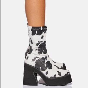 Cow print platform boots